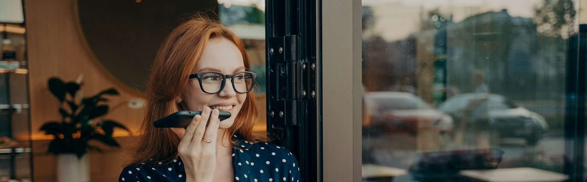 Young woman makes voice call uses modern technologies for communication